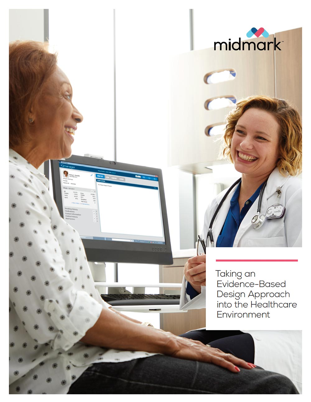 Woman doctor and woman patient smiling in the doctors office 