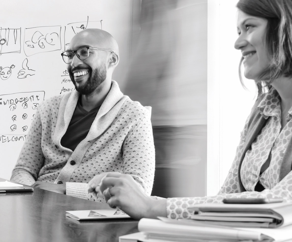Employees laughing in a meeting
